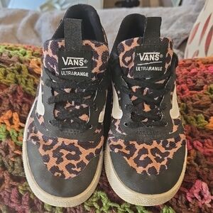 Vans Black and Pink Sneakers with Bold Design